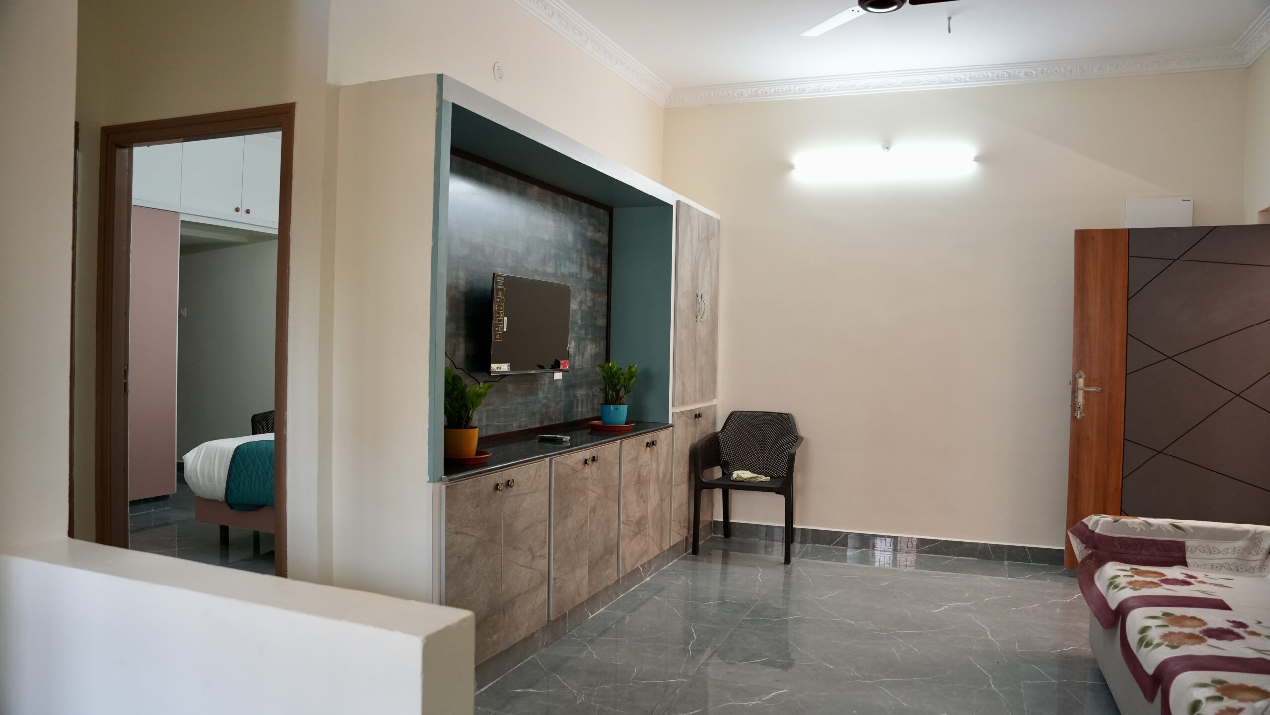 SS7 Homes living room with sofa and TV Tirupati